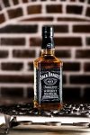 jack-daniels-whiskey-bottle-iron-grating-famous-brand-best-selling-american-world-128979276.jpg